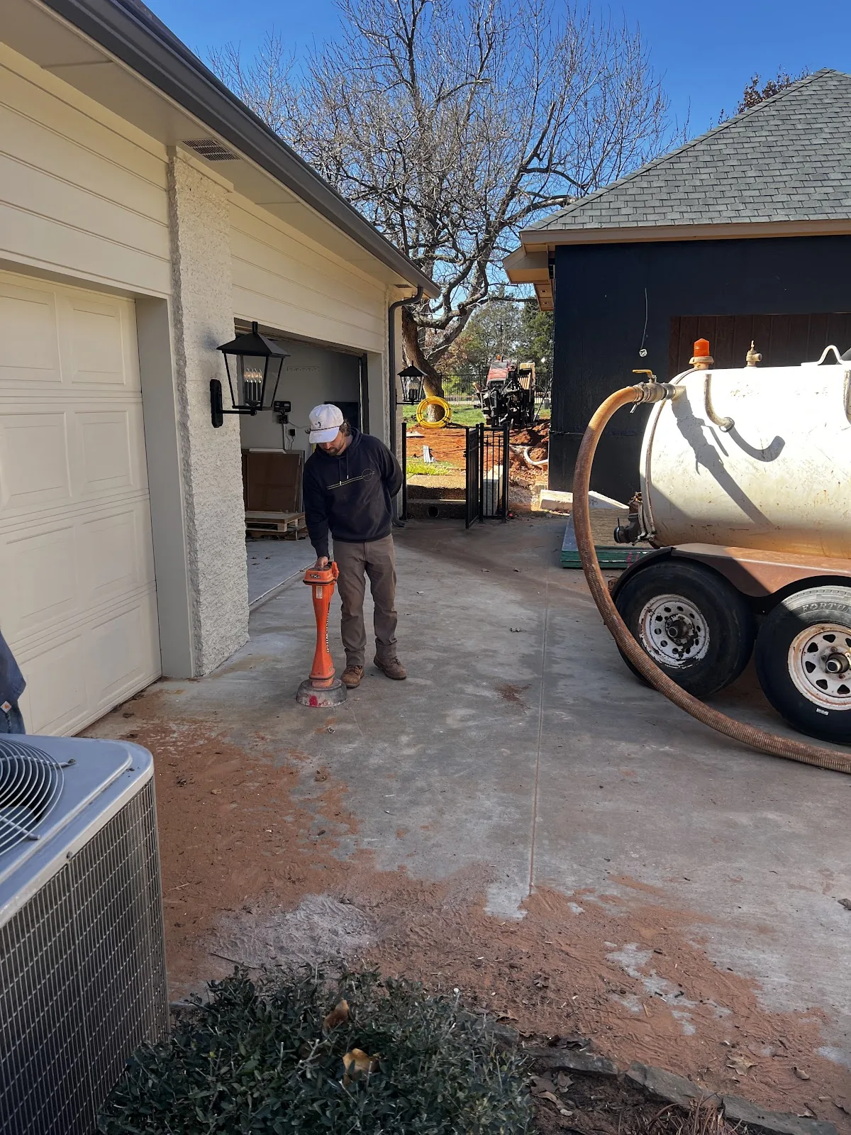 Bore Equipment Concrete Surface Dallas Texas HDD Contractors Texas HDD Contractors electric conduit boring and hydro-vac daylighting along a curb line in Dallas HDD trenchless